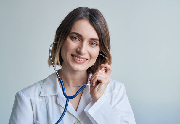 Doctor medical gown nurse stethoscope health light background - Фото, зображення