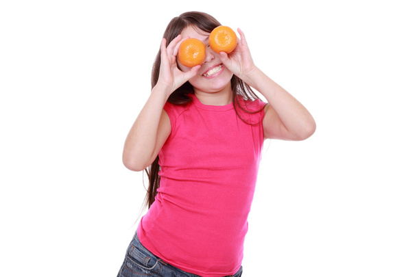 Girl holding mandarins - Fotoğraf, Görsel