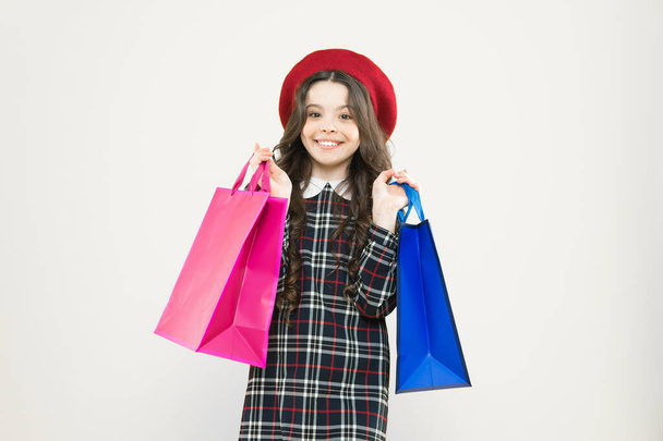 Black friday. Sale discount. Shopping day. Child hold package. Favorite kids brand. Girl with shopping bag. Save money. Live better. Rediscover great shopping tradition. Shopping and purchase - 写真・画像