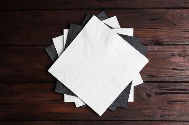 Clean napkins on wooden table, top view - Photo, Image