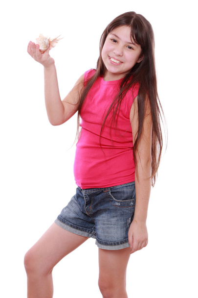 Girl holding seashell - Foto, afbeelding