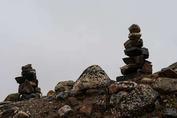 small towers made of stones from travelers  - Photo, Image