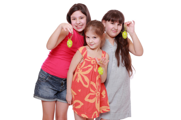 Girls holding eggs for Easter - Фото, изображение