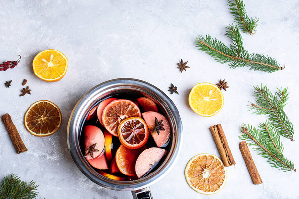 Delicious mulled wine and ingredients on grey table, flat lay. Space for text. Christmas content - Photo, Image