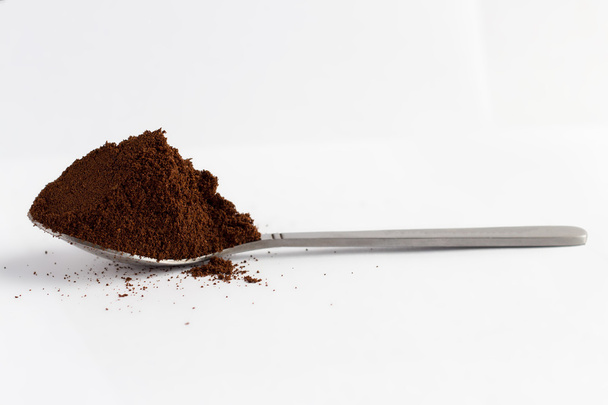 Spoon with ground coffee - Fotó, kép