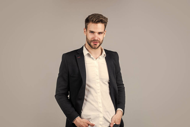 he got great style. Portrait of a handsome CEO. Businessman in suit. Young handsome man. Young manager in his office. portrait of a businessman on grey background. confident businessman portrait - Valokuva, kuva