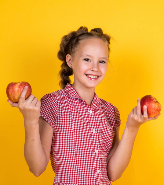 Express positivity. full of vitamins. organic food only. natural and healthy. happy childhood. kid eat apple. child with fruit. teen girl carry apples. autumn harvest. spring season fruits - Valokuva, kuva