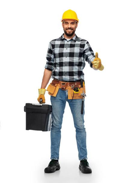 happy male worker or builder showing thumbs up - 写真・画像