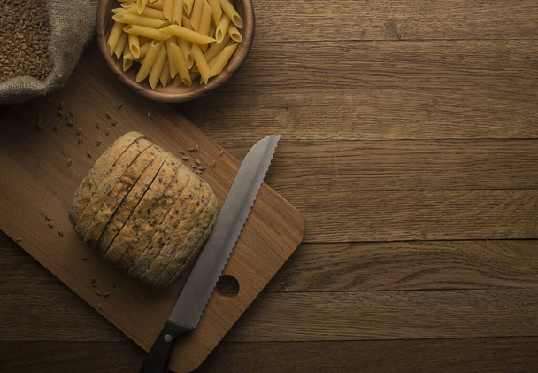 sliced bread on wooden background - Zdjęcie, obraz