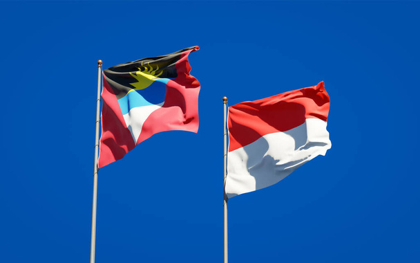 Gyönyörű nemzeti zászlók Indonézia és Antigua és Barbuda együtt az ég hátterében. 3D-s művészeti koncepció.  - Fotó, kép