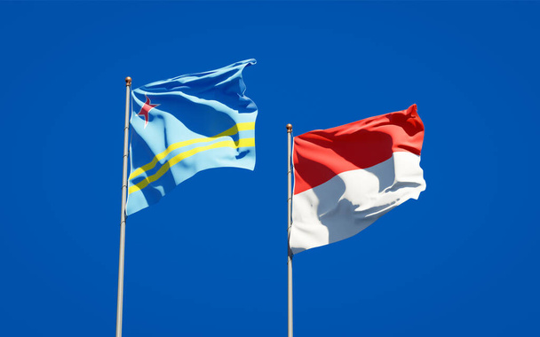 Piękne flagi państwowe Indonezji i Aruby razem na tle nieba. Koncepcja grafiki 3D.  - Zdjęcie, obraz