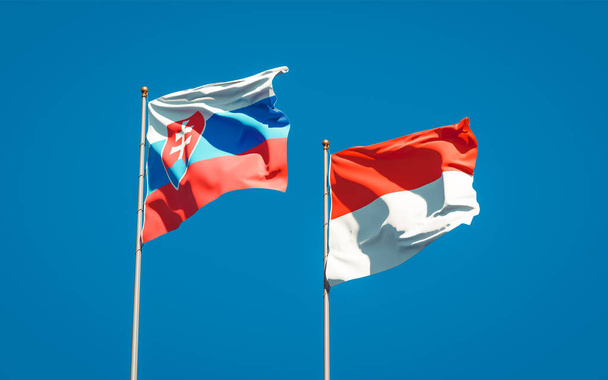 Prachtige nationale staatsvlaggen van Slowakije en Indonesië samen op de achtergrond. 3D-kunstwerkconcept.  - Foto, afbeelding