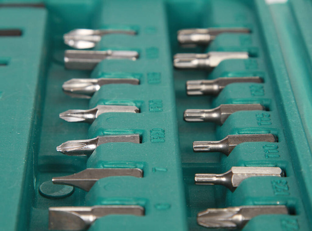 A closeup high angle shot of a screwdriver bit set - Фото, изображение