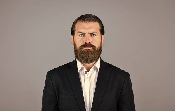 handsome man wear office suit. male beauty and fashion. brutal businessman with perfect beard and moustache. real boss in jacket. mature man has serious look. confidence and charisma - Foto, afbeelding