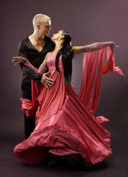Dancers against black background - Foto, Imagen