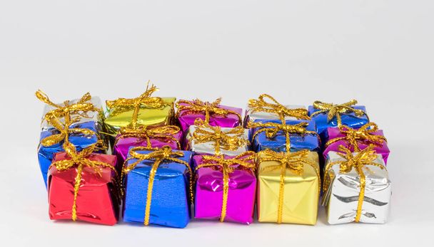 A shot of beautiful colorful gift boxes on a white background - Φωτογραφία, εικόνα