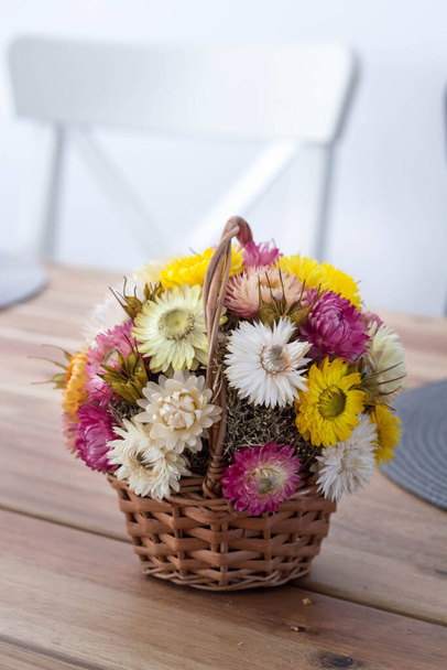 Autumn decoration of strawflowers on the table - Photo, Image