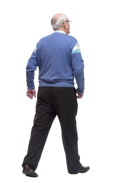 rear view. an elderly man confidently striding away - Фото, зображення