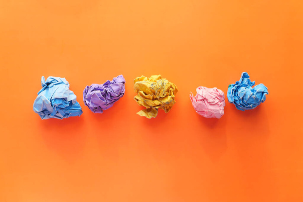 top view of crumpled paper balls on orange background  - Fotó, kép