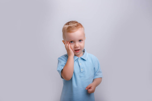 emotional portrait of a little boy in the studio - Photo, image