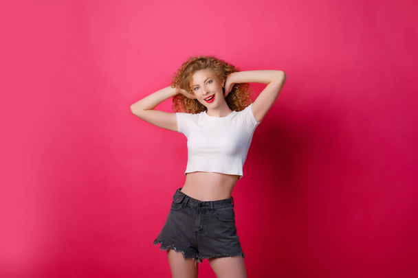 beautiful girl posing on the pink background  - Фото, изображение