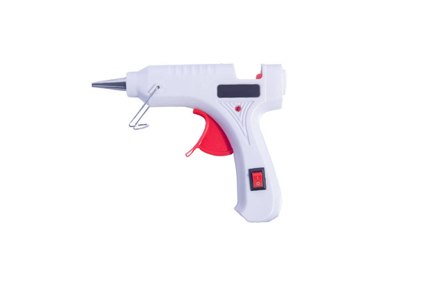 крупним планом клейовий пістолет ізольований на білому фоні клейовий пістолет, ізольований на білому
 - Фото, зображення