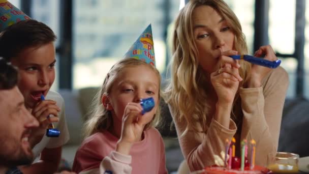 Mom dad kids celebrating birthday online. Happy family having fun party blowers. - Footage, Video