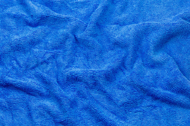 青いマイクロファイバーの布の質感の背景. - 写真・画像