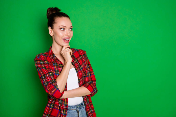 Turned photo of positive cheerful girl touch chin fingers look copyspace think thoughts enjoy summer holiday plan wear checked shirt isolated over shine color background - Fotó, kép