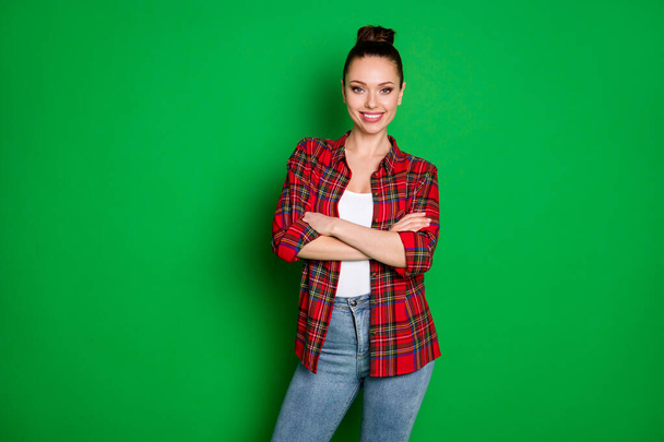 Portrait of her she nice attractive pretty lovely charming content cheerful cheery brown-haired girl wearing checked shirt folded arms isolated over bright vivid shine vibrant green color background - Фото, зображення