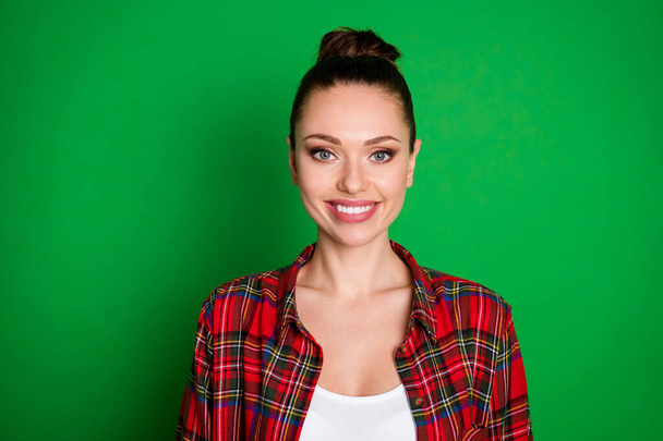 Portrait of content sweet attractive girl look in camera toothy smiling wear checked shirt isolated over bright color background - Foto, imagen