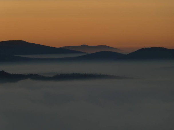 sunrise above the clouds of inversion i the valley from the hill - 写真・画像
