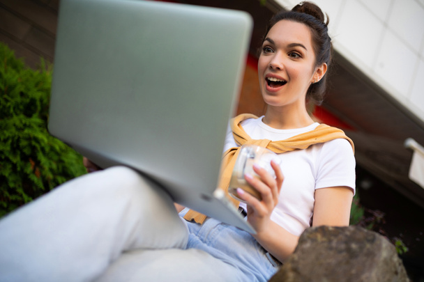 successful woman freelancer cute smiling sitting outdoors with computer - Photo, Image