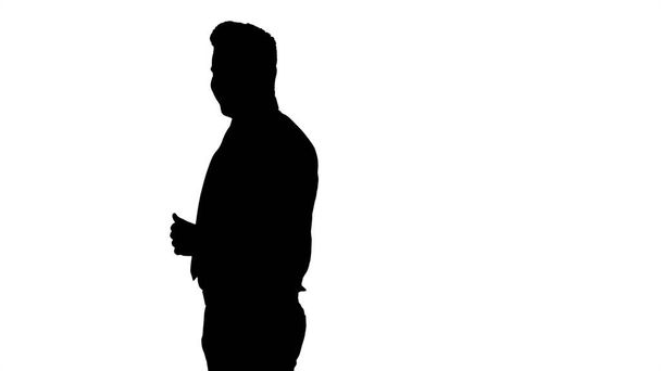 Silhouette Follow me. Young businessman walks in frame and invites you to follow him. - Φωτογραφία, εικόνα