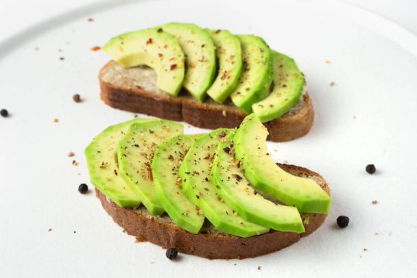 Vegetarian dish with avocado on a light background. - Photo, Image