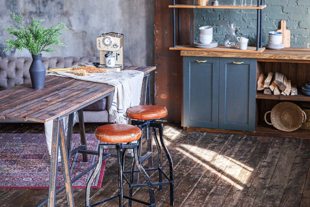 Scandinavian classic minimalistic dark gray kitchen with wooden details. Stylish loft modern gray kitchen decoration with clean contemporary style interior design - 写真・画像