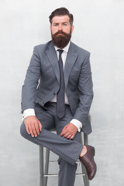 Fairness and justice. Classy and formal. Bearded man wear formal suit. Elegant lawyer sit on chair. Business meeting. Formal event. Man with beard and mustache confident lawyer. Your lawyer - Fotoğraf, Görsel