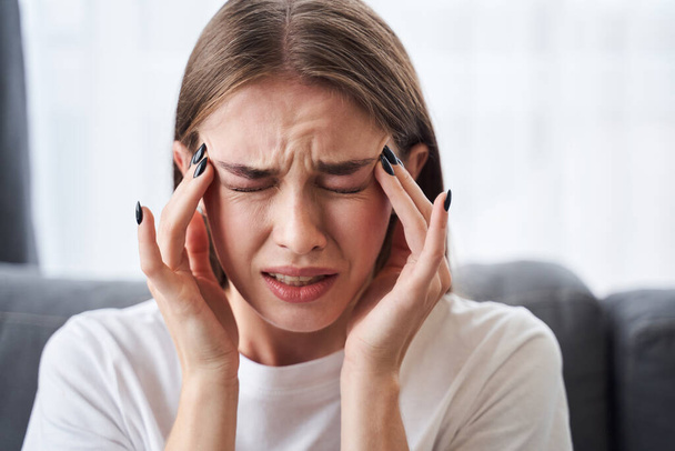 Woman suffering from headache - Фото, зображення