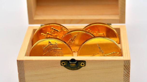 Gold coins inside a wooden chest - Photo, Image