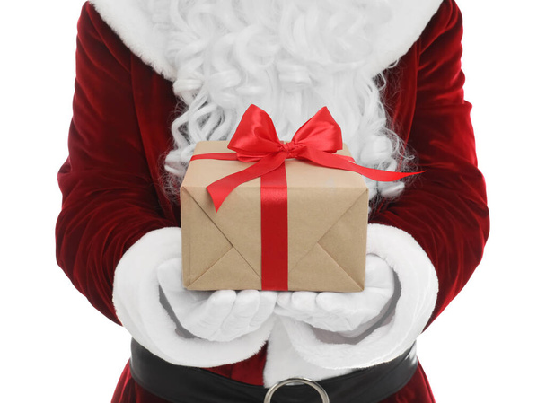 Santa Claus holding Christmas gift  on white background, closeup - Photo, Image