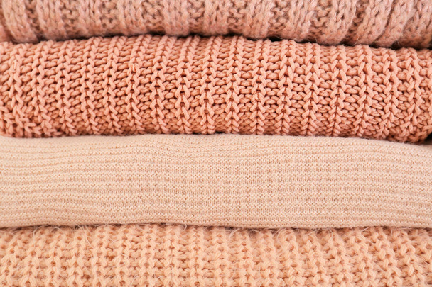 Stack of warm winter clothes as background - Photo, Image