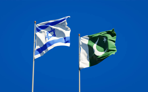 Izrael és Pakisztán gyönyörű nemzeti zászlói együtt az ég hátterében. 3D-s művészeti koncepció.  - Fotó, kép