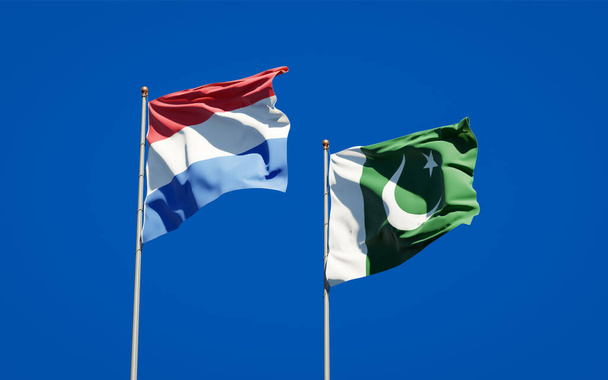 Prachtige nationale vlaggen van Nederland en Pakistan samen op de achtergrond. 3D-kunstwerkconcept.  - Foto, afbeelding