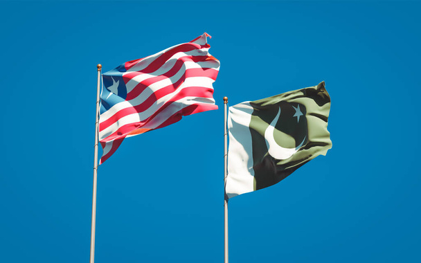 Libéria és Pakisztán gyönyörű nemzeti zászlói együtt az ég hátterében. 3D-s művészeti koncepció.  - Fotó, kép