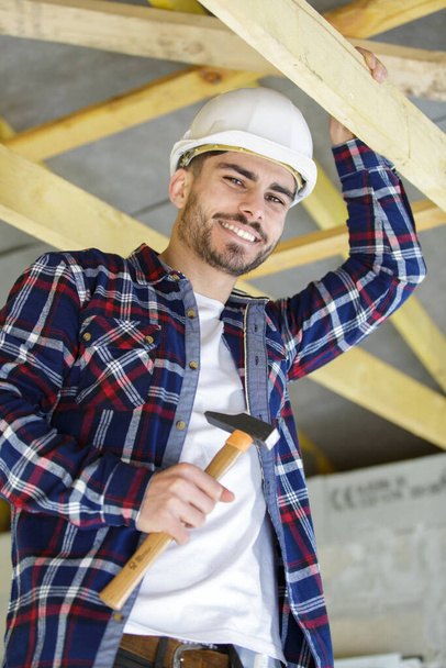 happy male carpenter with hammer - Фото, изображение