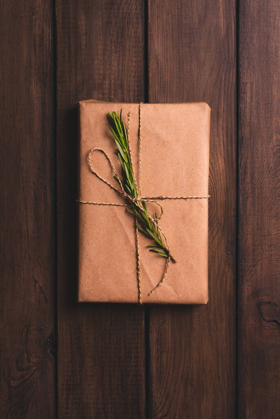 Christmas gift boxes decorated kraft paper, rosemary. Top view, vertical orientation - Foto, immagini