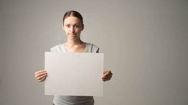 Person holding white empty paper - Foto, imagen