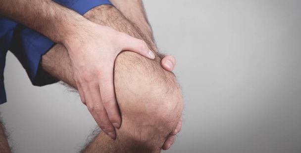 Caucasian man suffering from knee pain. - Photo, Image