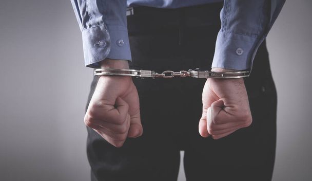 Caucasian man hands in handcuffs. Arrest - Photo, Image