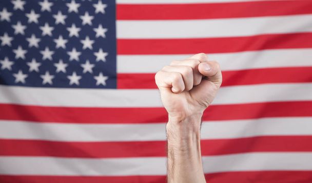 Male hand USA flag. Male fist - Foto, afbeelding